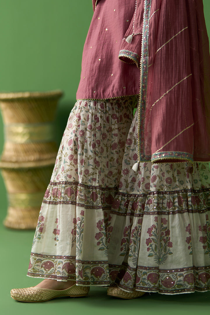Gulnaar Ivory With Onion Pink Solid short kurta with block printed gharara and gota work dupatta ( set of 3)