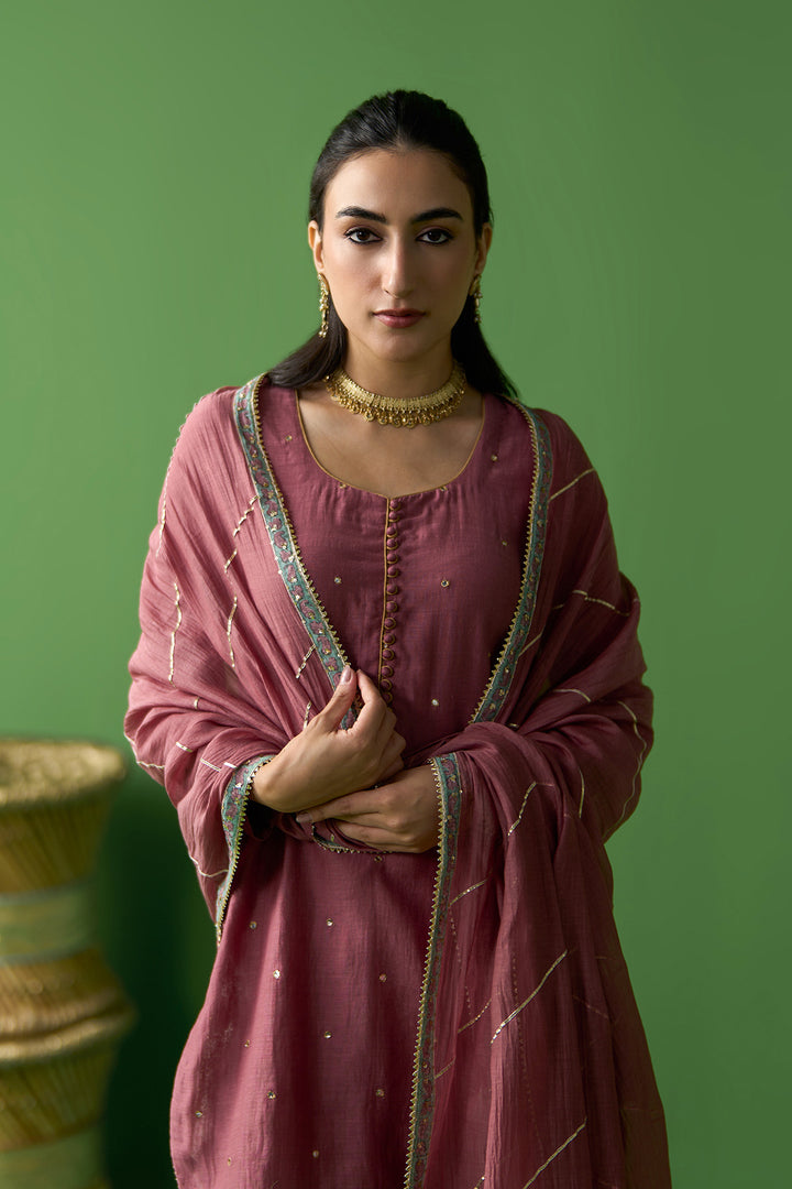 Gulnaar Ivory With Onion Pink Solid short kurta with block printed gharara and gota work dupatta ( set of 3)