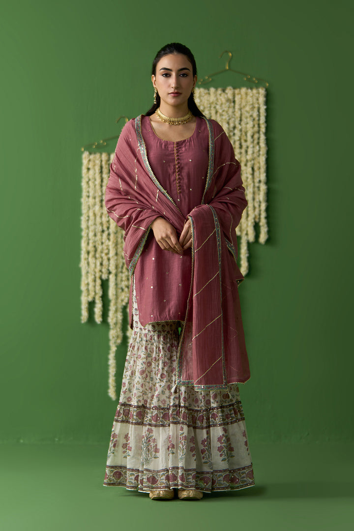 Gulnaar Ivory With Onion Pink Solid short kurta with block printed gharara and gota work dupatta ( set of 3)