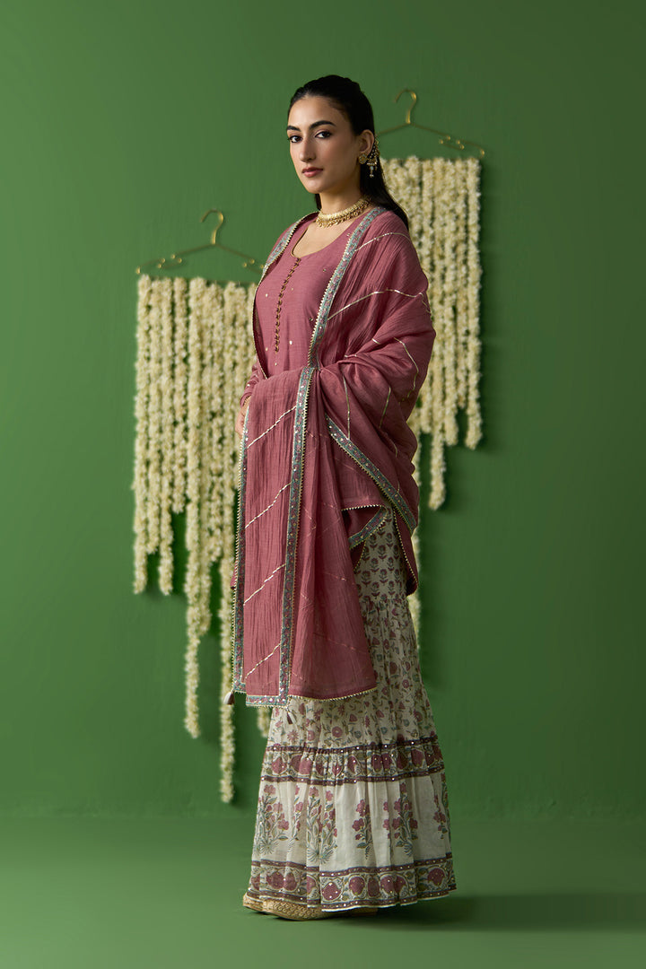 Gulnaar Ivory With Onion Pink Solid short kurta with block printed gharara and gota work dupatta ( set of 3)