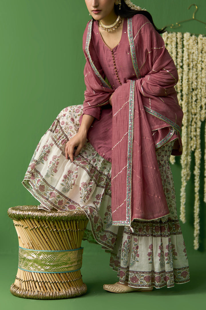 Gulnaar Ivory With Onion Pink Solid short kurta with block printed gharara and gota work dupatta ( set of 3)