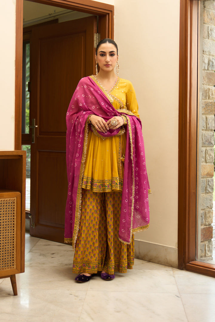 Saanjh block printed mustard angrakha with sharara and bandhej dupatta( set of 3)
