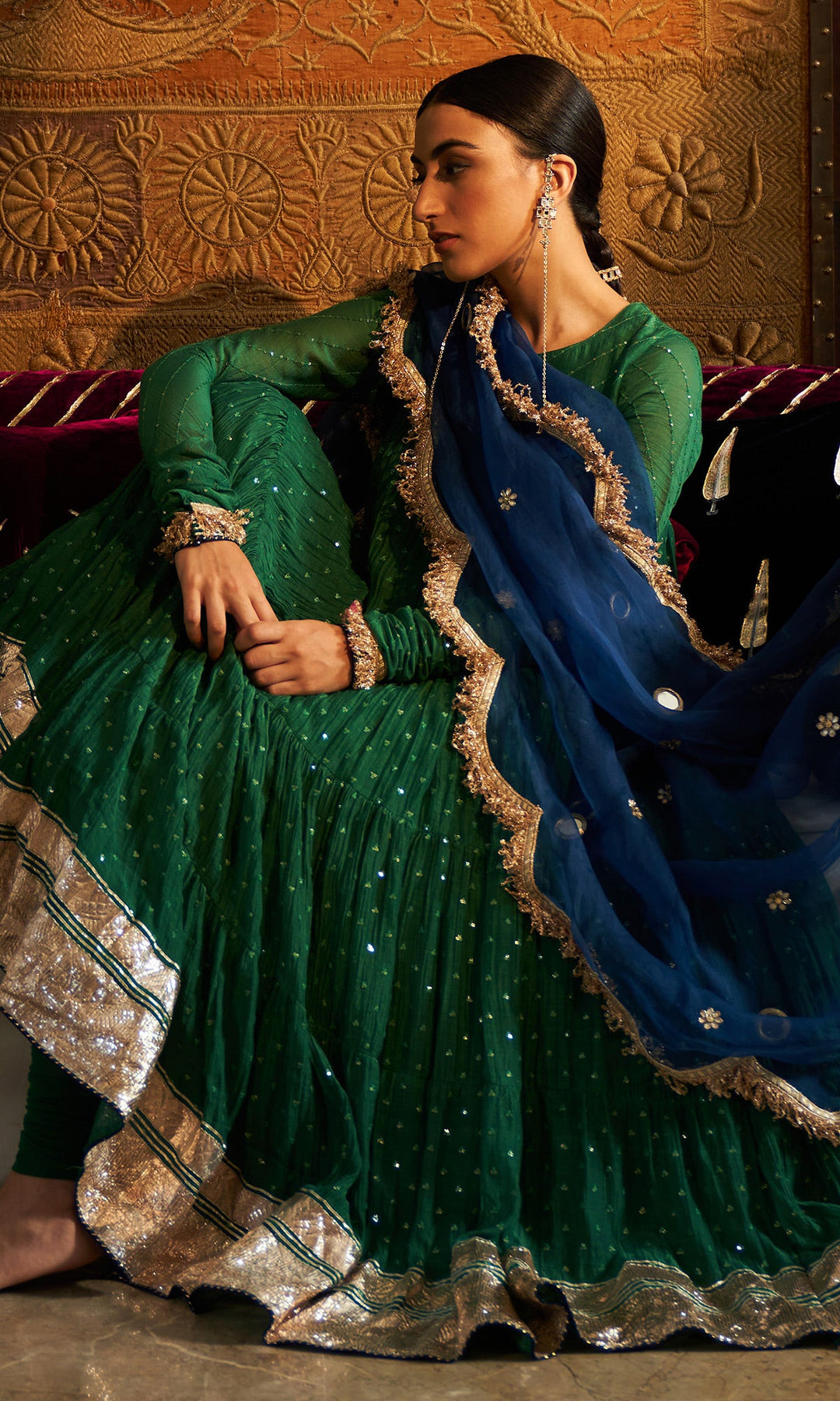 emerald green silk festive tiered anarkali dress Make a statement with this bold and versatile green fusion wear! Get two outfits in one and style it as you like with or without the jacket. A perfect blend of